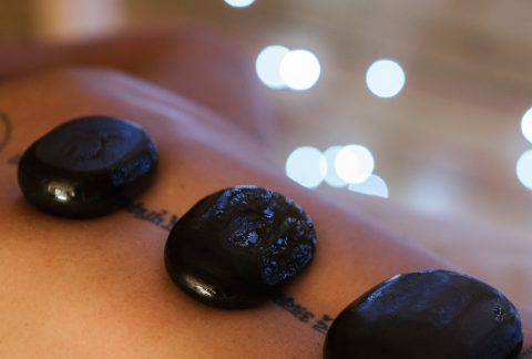 Hot stone treatment on a patient